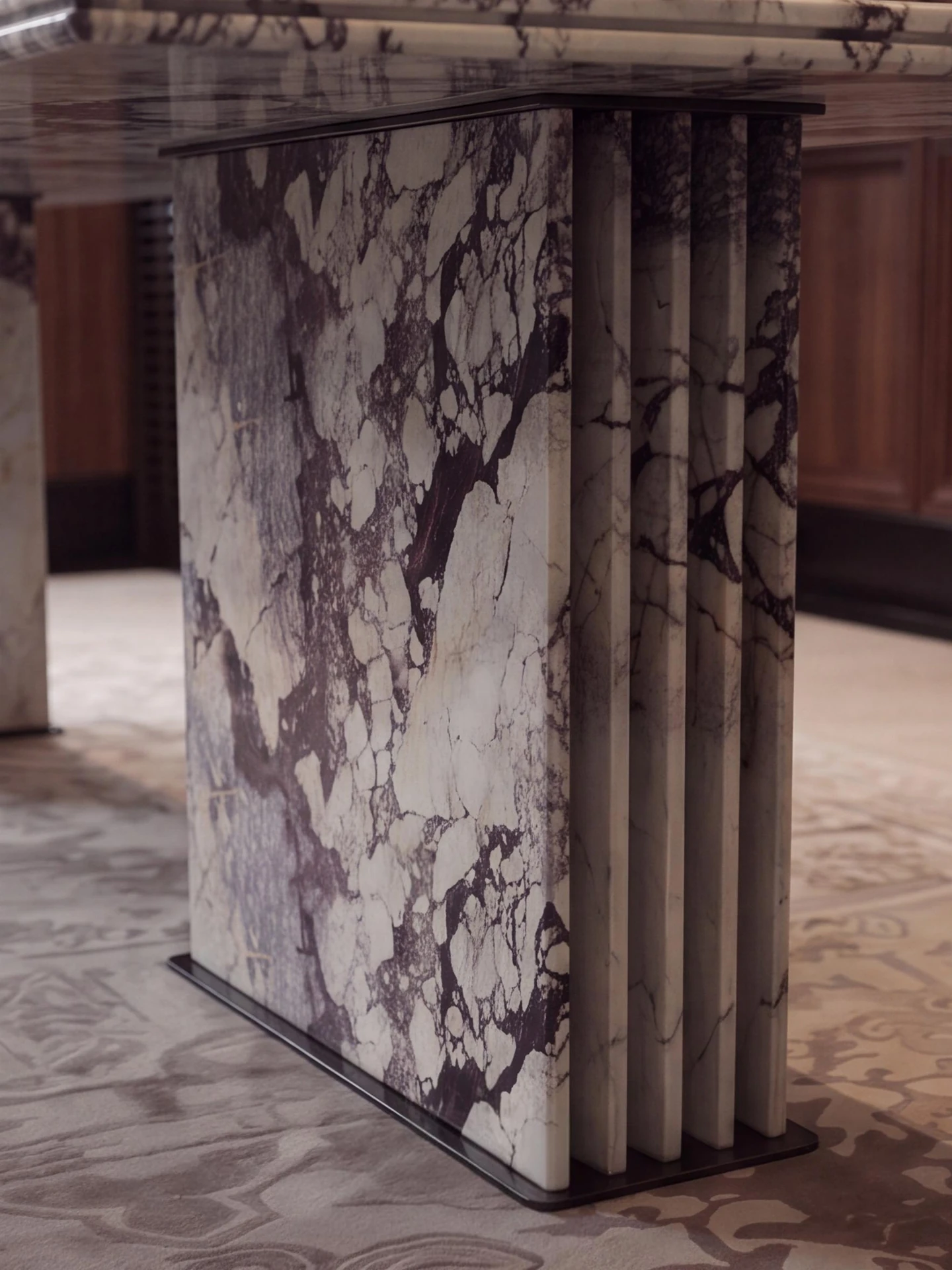 Repeated vertical stone elements in a collected table-base reference.