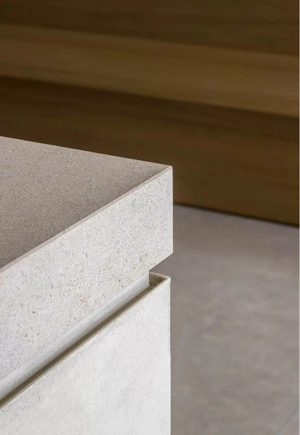 A crisp stone countertop corner above a recessed joint