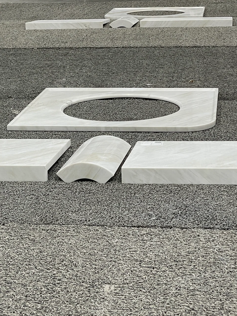Shaped stone parts arranged in a fabrication workshop