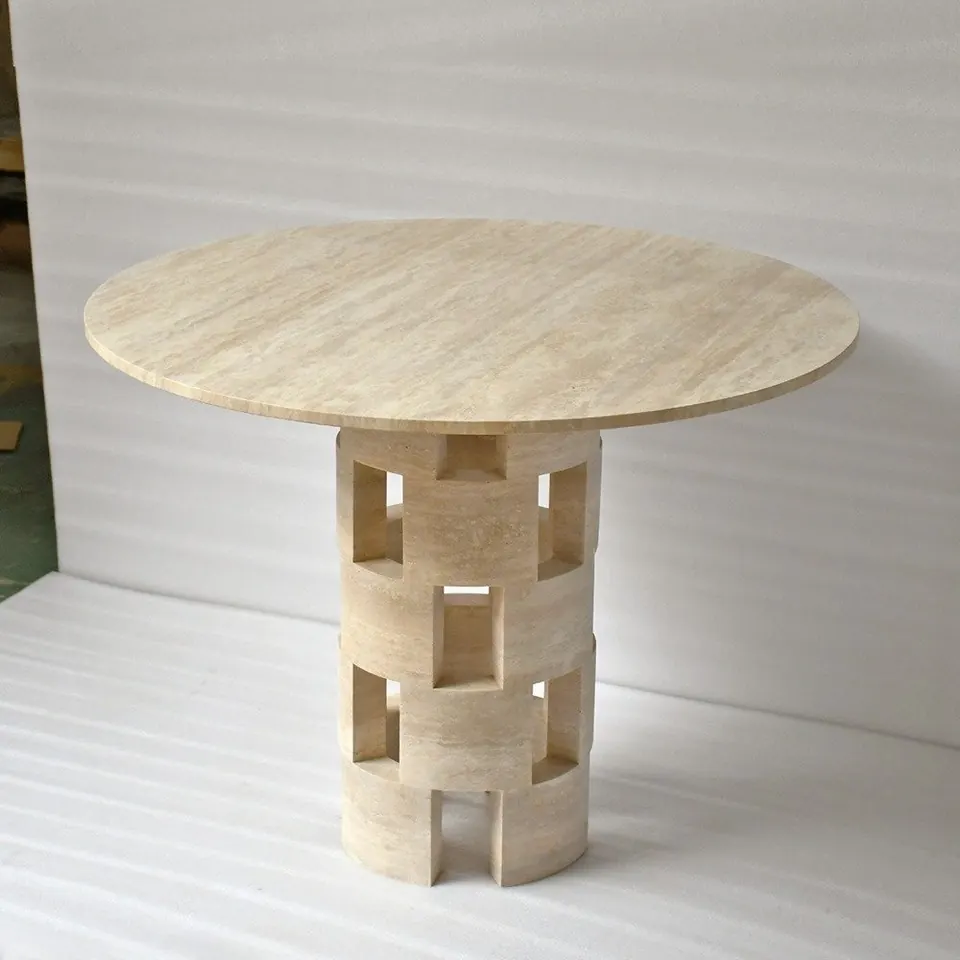 Round travertine dining table on a lattice drum base